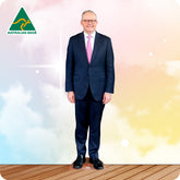 Man in a suit with a pink tie standing against a gradient background with 'Australian Made' logo.